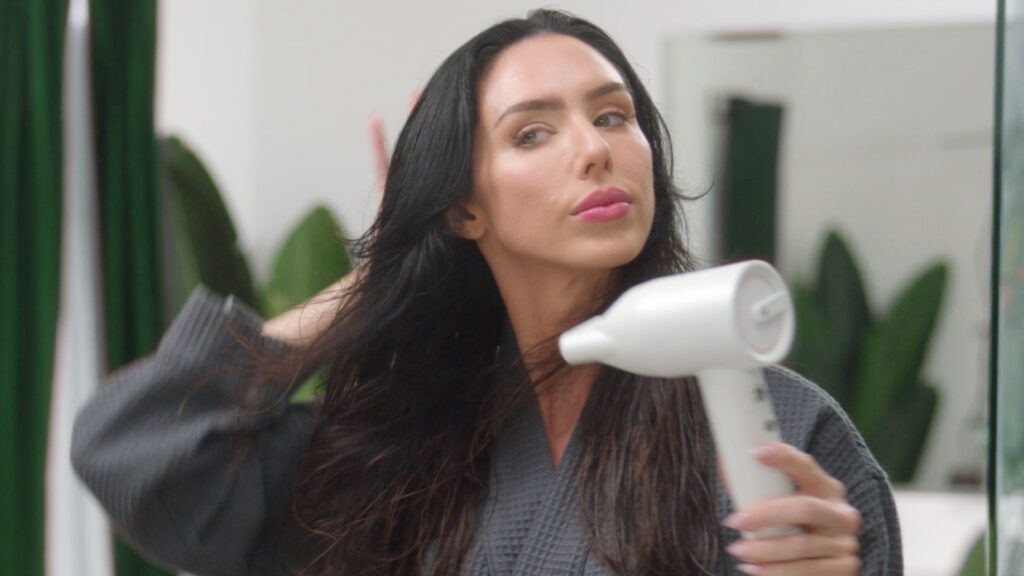 woman using ionic hair dryer