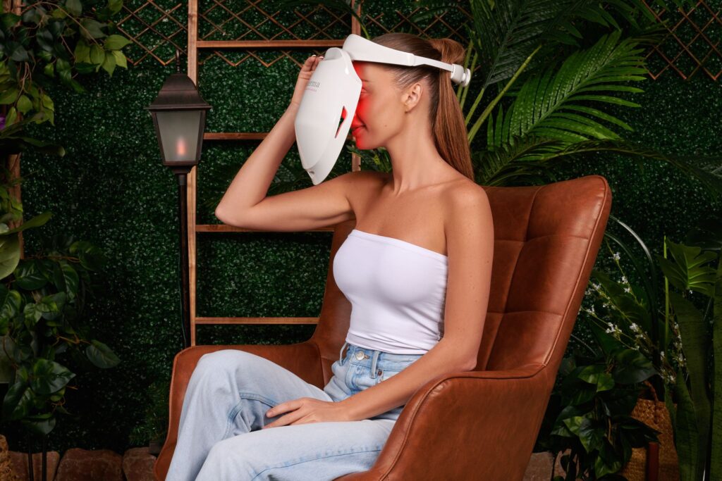 woman using iDerma red light therapy skin rejuvenation mask